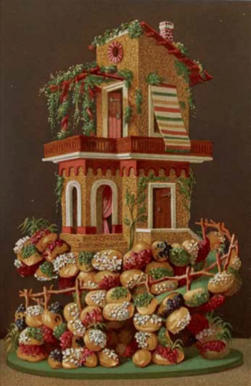 Réalisation en pâtisserie en forme de maison décorée.